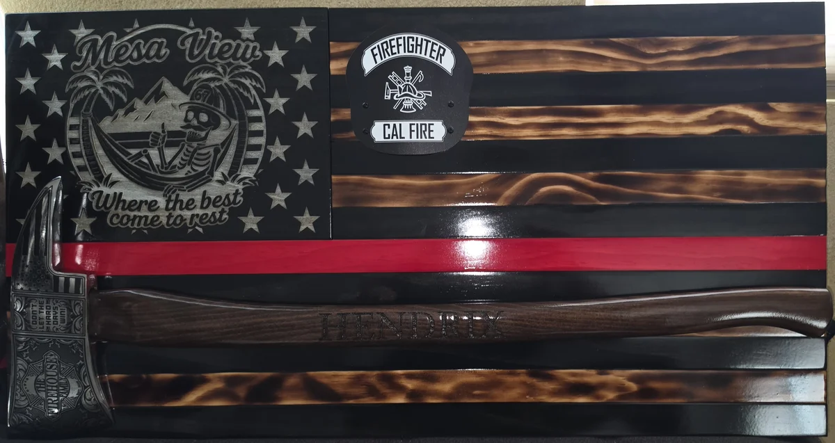 Michael Hendrix's retirement flag with his helmet shield and an axe engraved HENDRIX